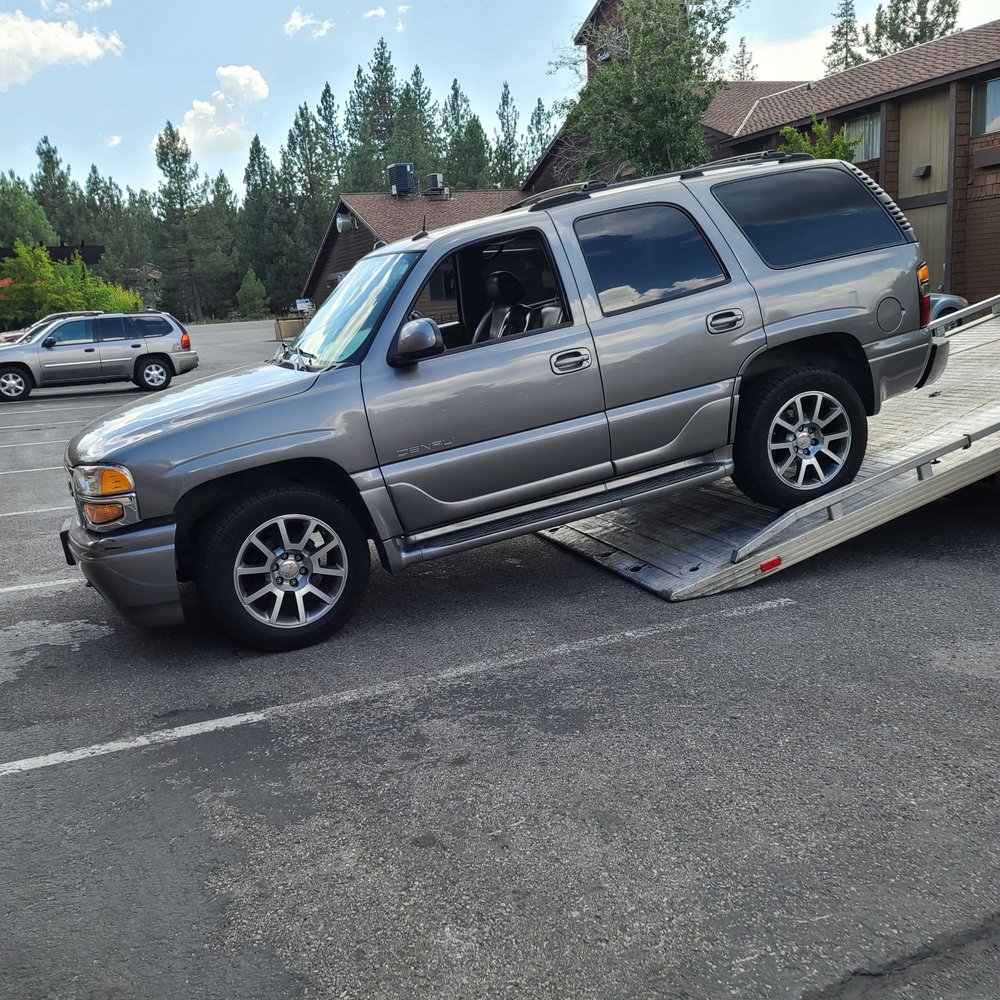 Suv being put on a tow truck